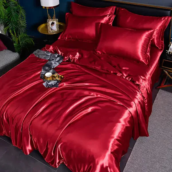Rotes Seidenbettwäsche-Set, luxuriös, glänzend, mit Kissenbezügen, Schlafzimmerdekoration.