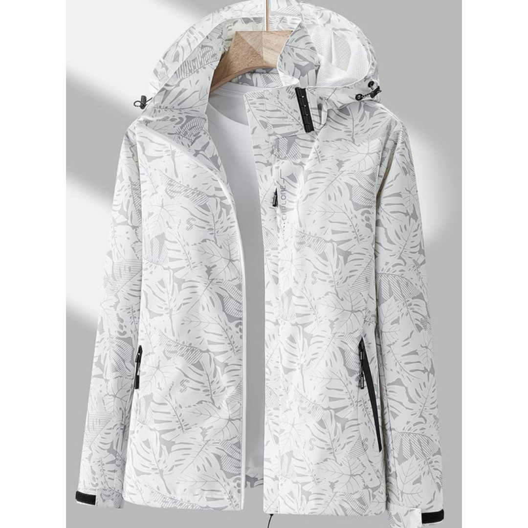 Weiße Damenjacke mit Kapuze, floralem Muster, Reißverschlüssen, ideal für Outdoor-Aktivitäten.