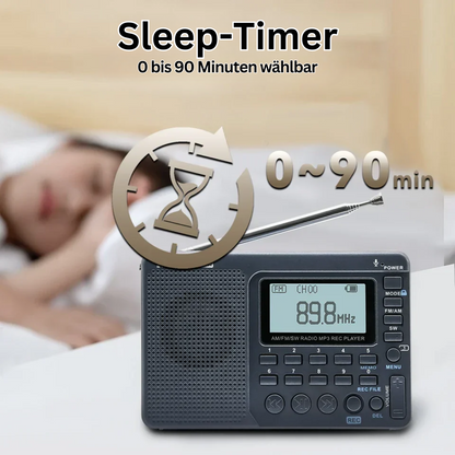 Schwarzes tragbares Radio mit Sleep-Timer, 0-90 Minuten, auf Nachttisch neben schlafender Person.