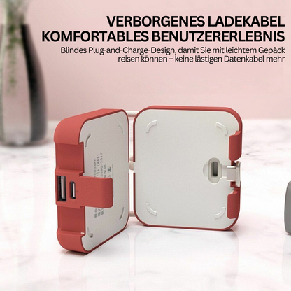 Rotes faltbares Ladegerät mit USB-Anschlüssen, kompakt für Reisen, modernes Design.
