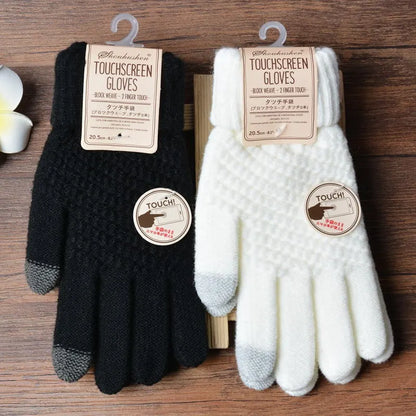 Schwarze und weiße Touchscreen-Handschuhe aus Strick, ideal für Smartphones.
