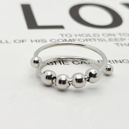 Silberner Ring mit Kugeln, minimalistisches Design, Modeschmuck, Damenaccessoire, elegant.