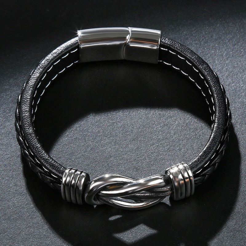 Schwarzes Lederarmband mit silbernem Magnetverschluss und Knotendesign für Herren.