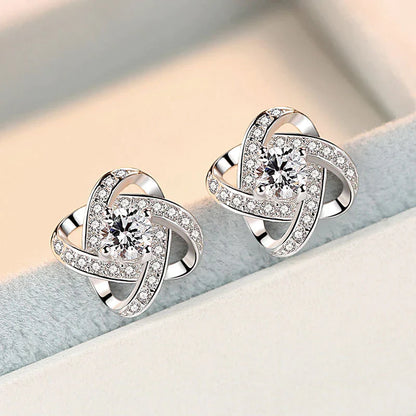 Silberne Ohrringe mit Zirkonia, funkelnd, elegantes Design, Schmuck für Damen, Geschenkidee.
