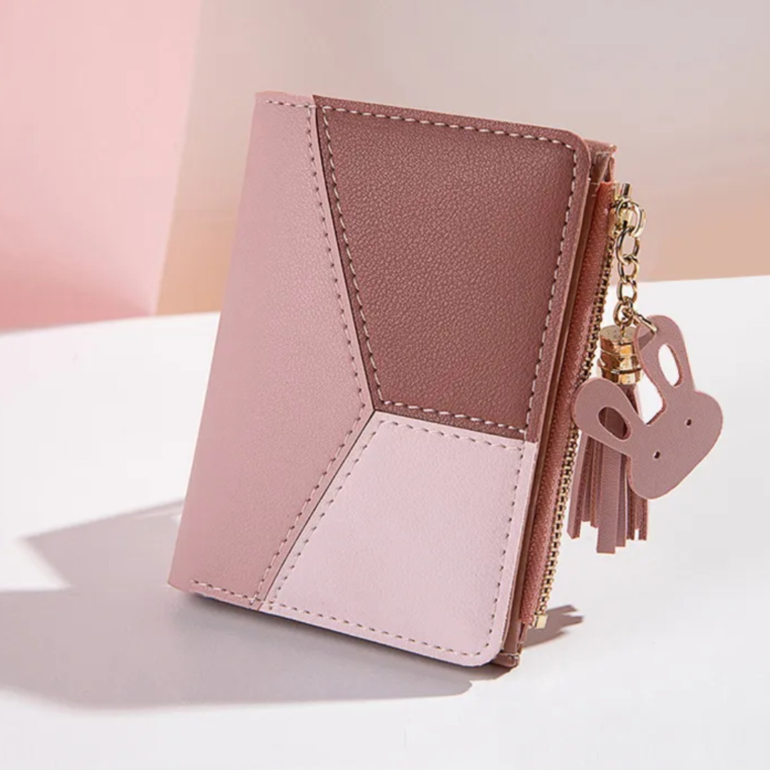Rosa Damen-Geldbörse aus Leder mit Reißverschluss und Hasenanhänger, modisch und elegant.